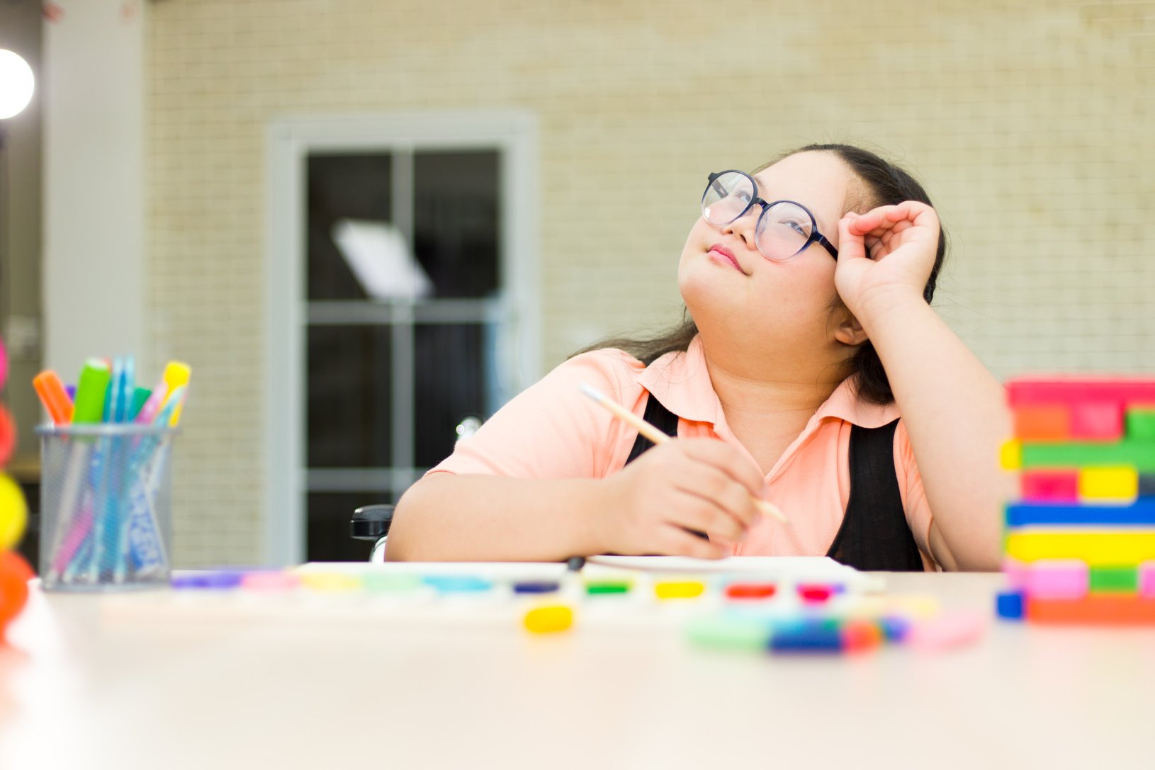 Autism girl with learning practice at home.